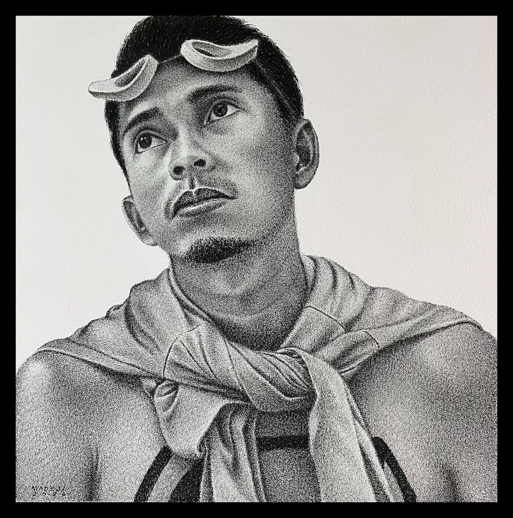 Mandaragat: portrait of a young fisherman with improvised wooden goggles pushed up on his forehead, gazing upward