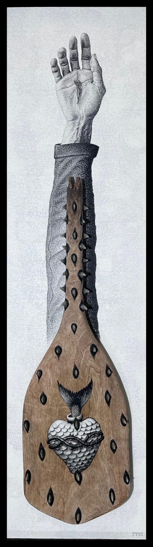 Manggad (Kayamanan): a thorn-studded carved paddle bearing a fish-scaled sacred heart, beneath a drawn arm raised open-palmed with a tiny fish in the palm