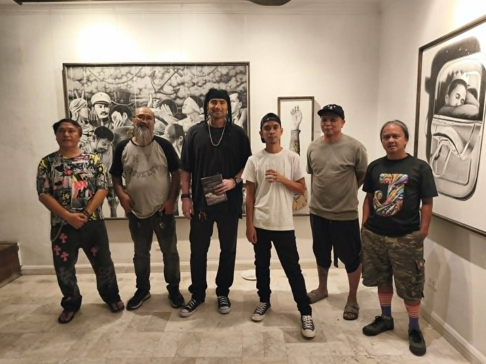 Jonathan Madeja with guests at the opening