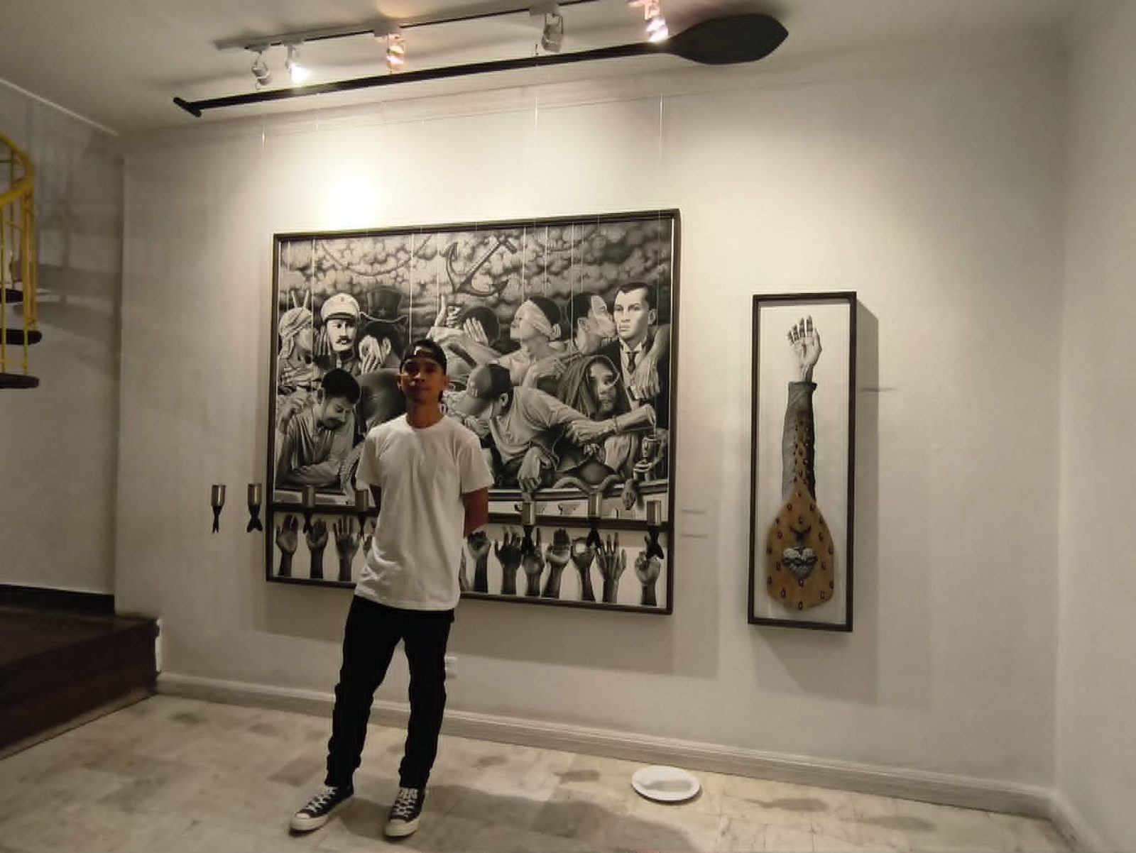Jonathan Madeja standing before the Langit Lupa installation